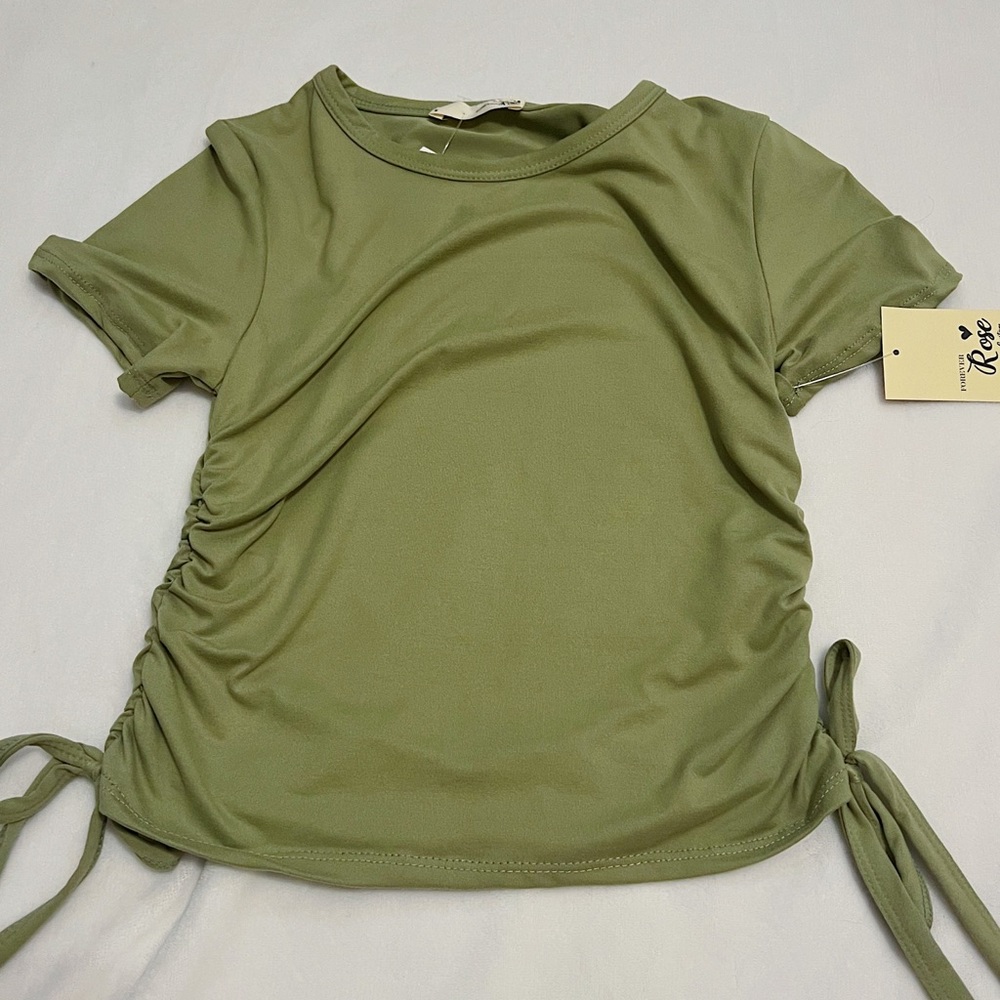 Green t-shirt with detailing on the sides